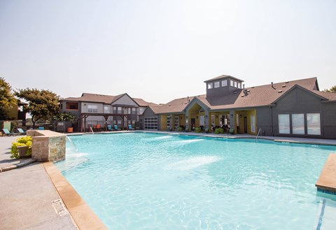 A large swimming pool in front of a house.at Flats on Chapel, Texas, 76712